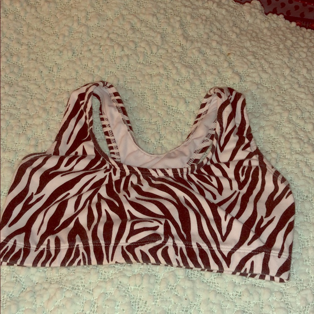 Zebra Sports Bra Size Small but is very stretchy and soft. In great condition.